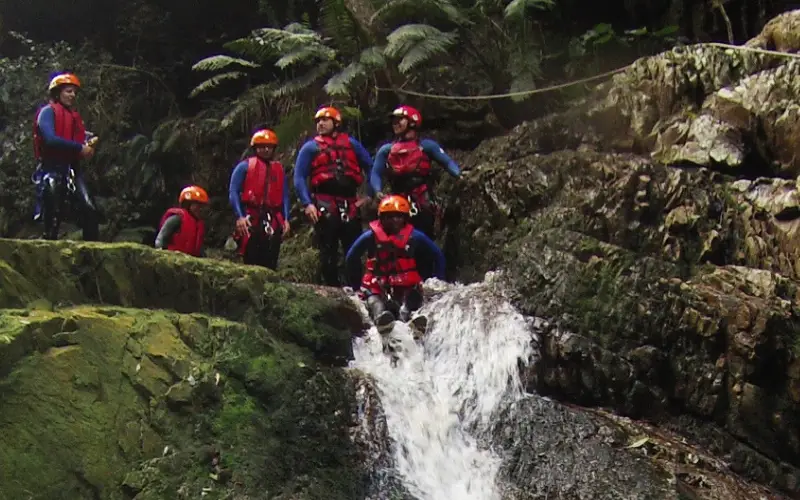 group of people canyoning