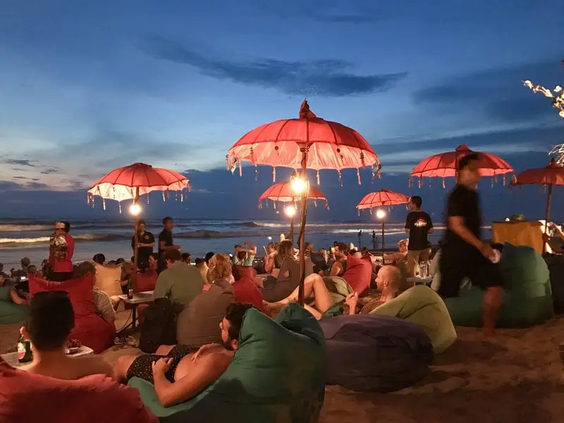 People lounging on Seminyak beach Indonesia