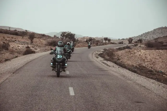 four motorcyclists in desert