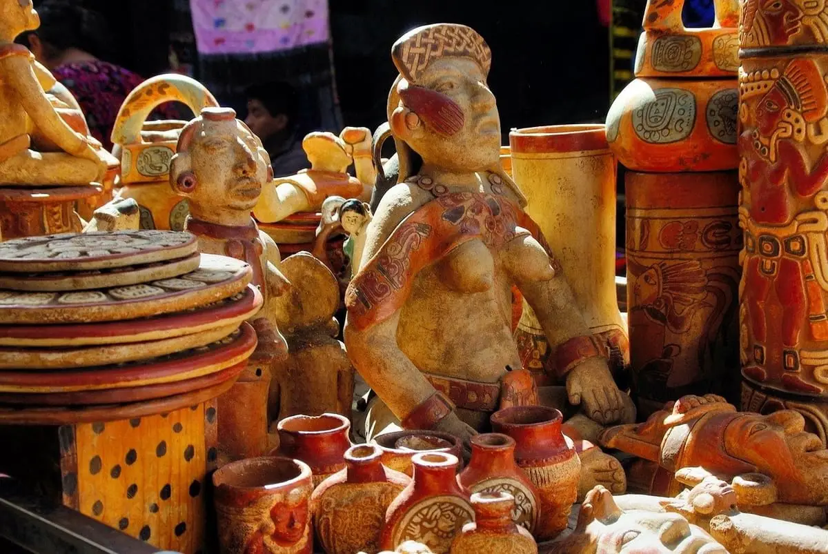 Collection of ancient Mayan trinkets and artefacts including statues