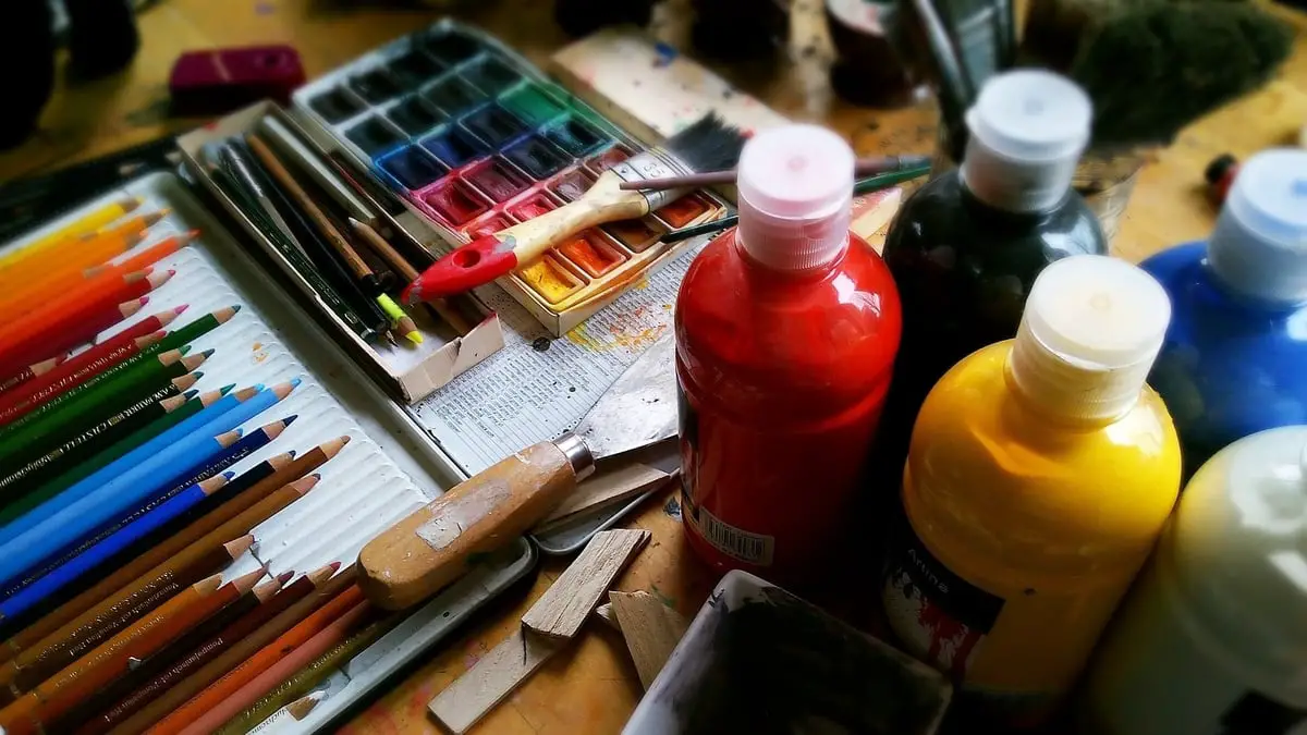 Photo of art supplies like paint, pencils and brushes
